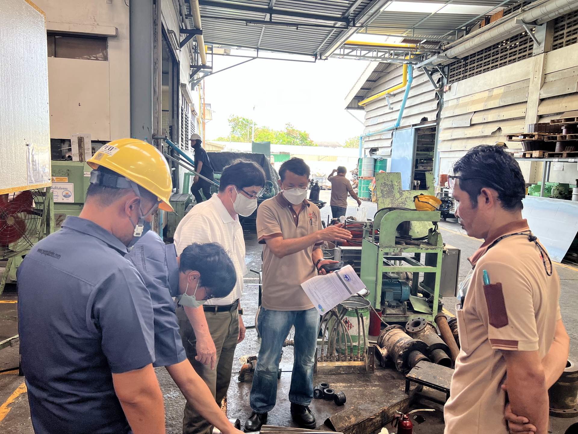 PEO service technicians inspecting industrial pump and machinery components during an on-site maintenance visit
